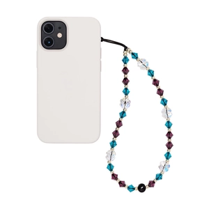 Detail view of purple and blue crystal beaded phone wrist strap on a white phone case