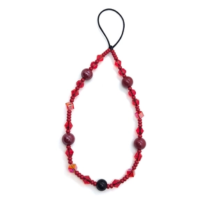 Detailed view of handmade red crystal beaded phone strap with multifaceted glass beads