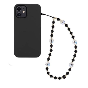 Detail of black and white faceted beaded wrist strap attached to a matte iPhone case
