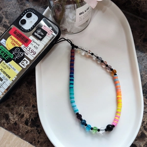 Colorful handmade phone wrist strap with gradient clay beads and crystal charms