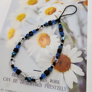 Blue crystal butterfly phone strap with handmade beads and transparent floral accents