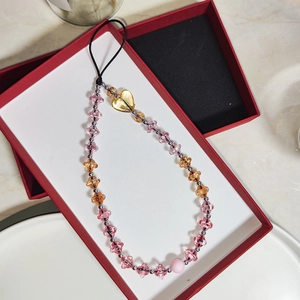 Rainbow acrylic heart beaded phone charm with pink and orange flower beads in a gift box