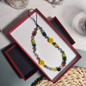 Vintage colorful beaded phone strap with yellow smiley faces and red jewelry gift box