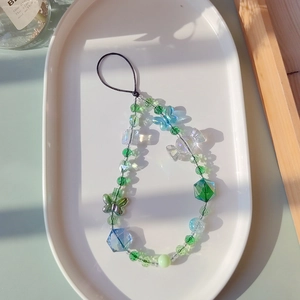 Handmade butterfly crystal beaded phone charm strap with green and blue translucent beads
