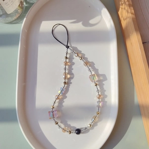 Iridescent butterfly beaded phone strap with amber crystals and black star accents