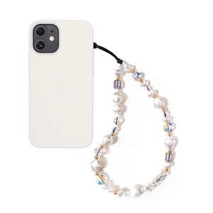 Detail of white beaded phone strap with iridescent crystals and golden beads on a white case