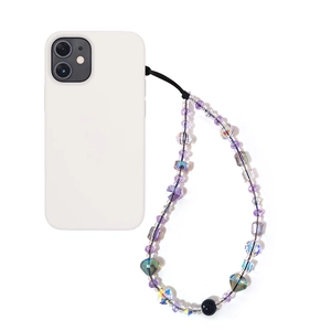 Detail of purple crystal beaded phone strap with heart charm on a white phone case