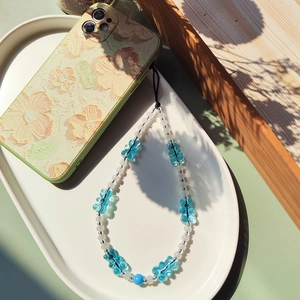 Handmade beaded phone strap featuring blue resin gummy bears and white round pearls