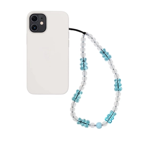 Detailed macro view of frosted white and blue bear-shaped beads on a mobile phone strap