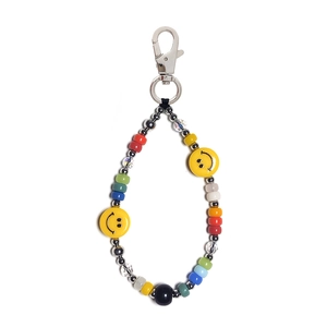 Colorful beaded keychain with yellow smiley faces and silver metal lobster clasp for bags