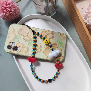 Colorful beaded phone strap with red heart, yellow smiley face, and white cloud charm