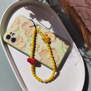 Minimalist beaded phone strap with yellow duck, red heart charm and floral case