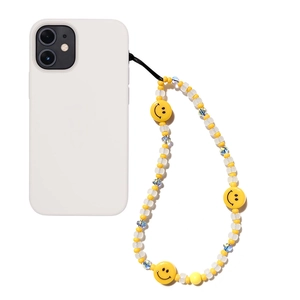 Handmade beaded phone strap with yellow smileys and white beads for a trendy mobile look