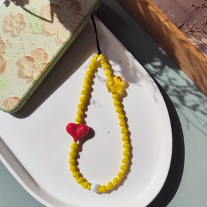 Handmade beaded phone strap with yellow duck, red heart bead, and clear yellow beads