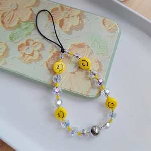 Handmade beaded phone strap with yellow smiley face charms and transparent crystal beads