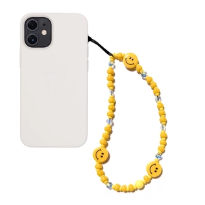 Colorful smile face beaded phone strap with bright yellow beads on white case