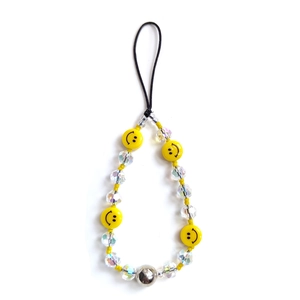 Handmade beaded phone charm with yellow smiley faces and transparent crystal beads