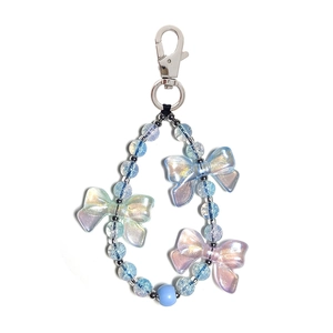 Handmade light blue beaded strap with iridescent bow and silver lobster clasp for bags