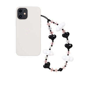 Detail of beaded phone strap with black hearts, white clouds, and pink faceted beads