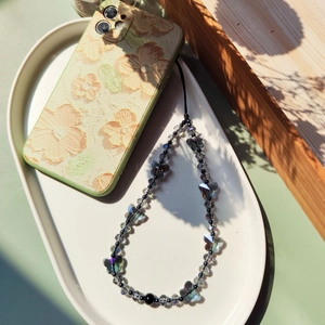 Bijou de téléphone fait main avec papillons en cristal et perles irisées foncées chic