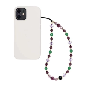 Detail of beaded phone charm with purple crystal beads attached to a white smartphone