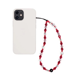 Détail d'une dragonne de téléphone en perles de cristal rouge et rose faite à la main