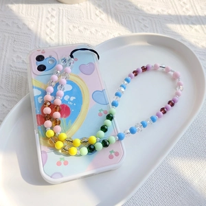 Detail of colorful beaded rainbow phone strap with cute illustrated lavender case