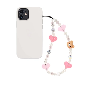 Handmade beaded phone strap with cute teddy bear charm and pink hearts on white background