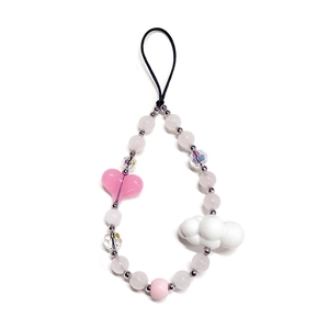 Pink and white beaded phone strap with heart and cloud charms on a white background