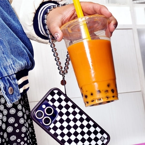 Detail of checkered phone case with silver metal beaded wrist strap for women
