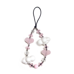 Detail of beaded phone strap with pink resin hearts, white clouds and floral charms