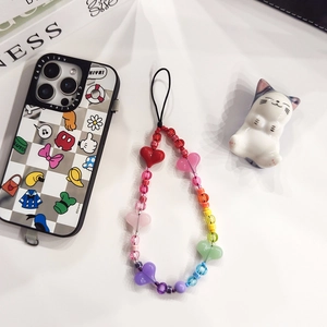 Rainbow ceramic beaded phone charm strap with acrylic hearts on white background