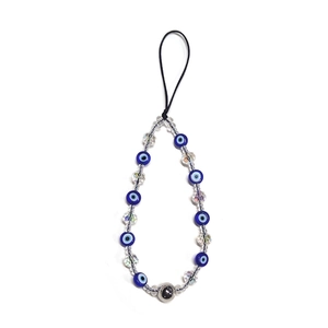 Detail of evil eye beads and transparent faceted crystal beads on handmade phone charm