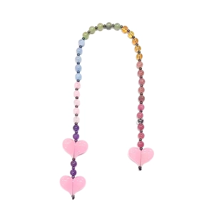Detailed macro view of colorful semi-precious bead bag charm with pink heart pendants