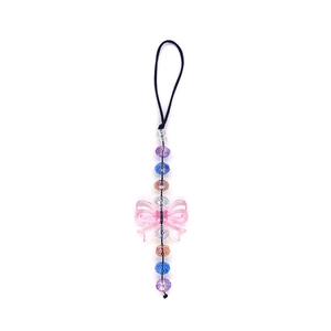 Handmade beaded phone strap with a translucent pink bow and multi-colored faceted beads