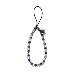 Handmade beaded phone strap with crystal beads and metallic skull charm on white backdrop