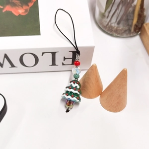 Handmade beaded Christmas tree phone charm with green tree pendant and red festive beads