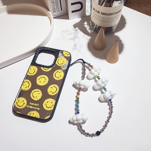 Cute iPhone case with yellow smiley faces and a white cloud beaded phone charm strap