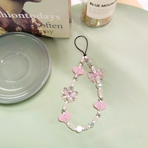 Pink heart and bow beaded phone strap charm accessory for women with a cute aesthetic