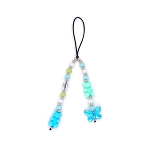 Detail of beaded phone strap with colorful resin beads, bear and butterfly charms