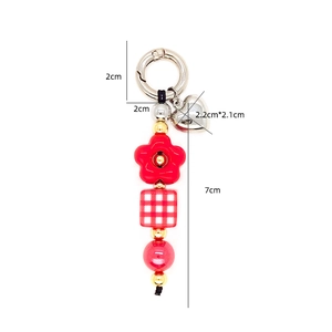 Red checkered bead keychain with heart pendant and flower charm for bag decoration