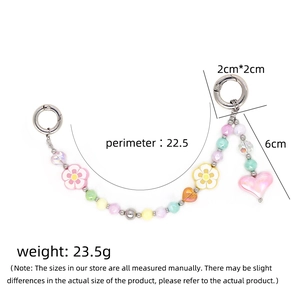 Sweet macaron flower beaded phone charm with pink heart pendant and silver clips