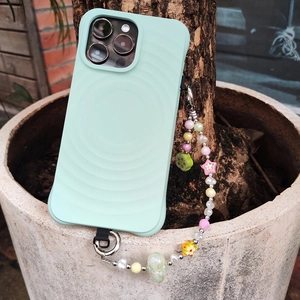 Mint green wavy silicone phone case with colorful floral bead charm and metal clip