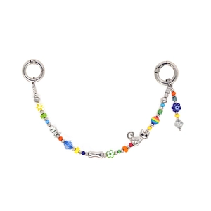 Colorful beaded phone charm with cat and fish charms and silver metal rings on white base