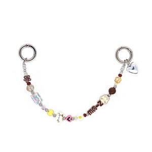 Detail of colorful beaded phone strap with NICE letter charms and cat pendants