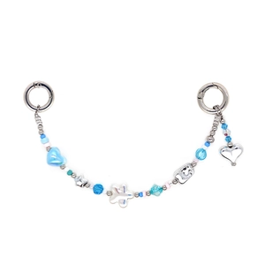 Detail of beaded strap with blue heart beads, silver stars and metal ring buckles