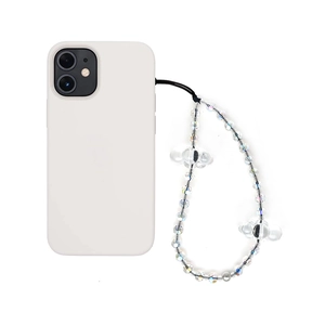 Detail view of iridescent faceted bead phone strap with floral accents on a white case
