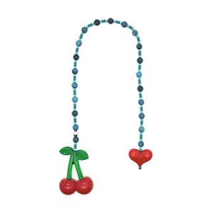 Detail of beaded bag charm featuring red cherry and heart pendants with colorful beads