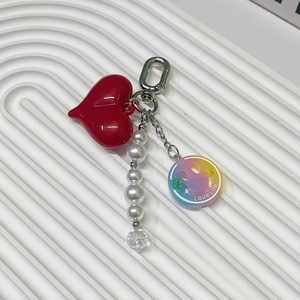 Rainbow smiley face keychain with red heart, white pearls and a colorful Love Life charm