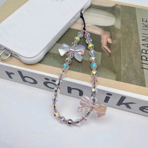 Pink butterfly beaded phone strap with iridescent crystals on white smartphone case